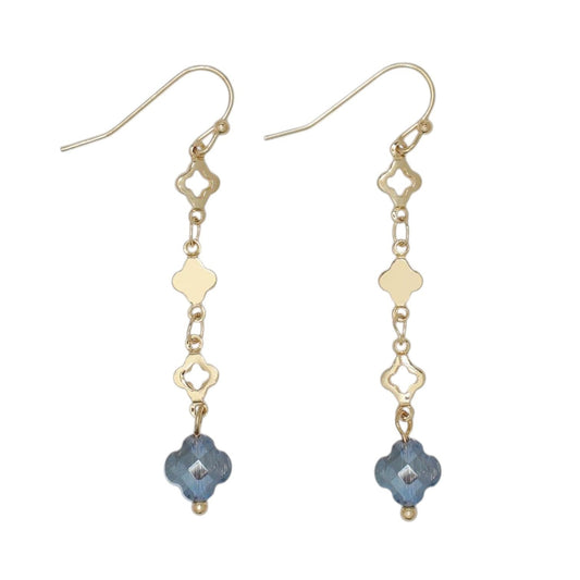 Mellow Monkey gold drop earrings featuring blue clover charms and delicate metal links for a coastal style.