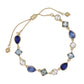 Mellow Monkey gold-tone bracelet featuring linked blue and clear crystals in teardrop and square shapes.