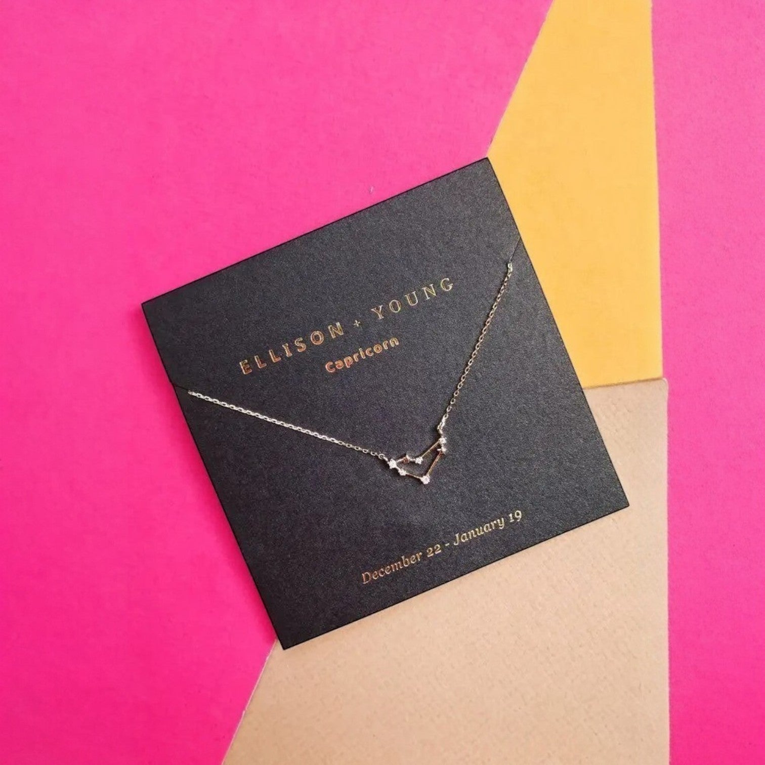 Mellow Monkey gold Capricorn zodiac constellation necklace with cubic zirconia accents, 16-inch chain.