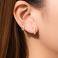 Mellow Monkey 18k gold plated hoop earrings with cubic zirconia, worn by a model.