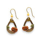 Mellow Monkey gold hoop earrings featuring a carved jack-o'-lantern, crescent moon, and leaf charm for autumn style.