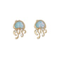 Mellow Monkey gold jellyfish stud earrings with iridescent AB aqua heart-shaped stones and clear crystal accents.