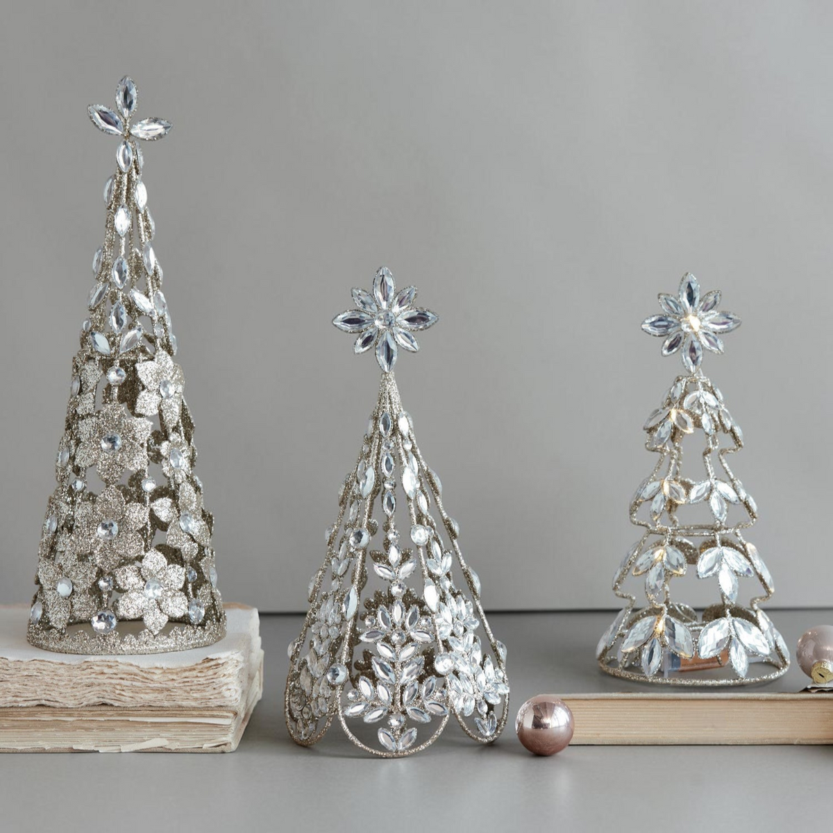 Mellow Monkey set of three cone-shaped metal trees in antiqued gold with acrylic jewels and sparkling glitter accents
