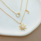 Mellow Monkey 18k gold plated necklace with sun pendant, moon charm, and cubic zirconia accents.