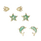 Mellow Monkey gold-tone ocean-themed stud earrings featuring fish, starfish, and dolphin designs with green enamel.