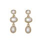Mellow Monkey gold drop earrings featuring three stacked oval pearls in a coastal, elegant design.