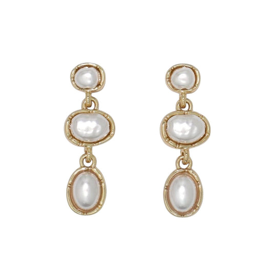 Mellow Monkey gold drop earrings featuring three stacked oval pearls in a coastal, elegant design.