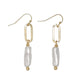 Mellow Monkey linear drop earrings featuring gold oval links and white baroque pearls for a coastal style.
