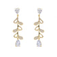 Mellow Monkey 18k gold plated dangle earrings with cubic zirconia accents in a vine design, featuring pear-shaped drops.