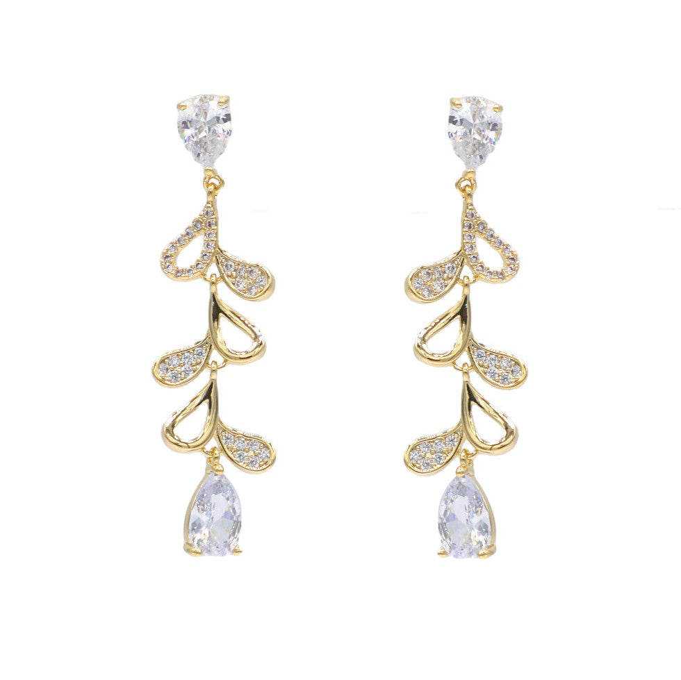 Mellow Monkey 18k gold plated dangle earrings with cubic zirconia accents in a vine design, featuring pear-shaped drops.