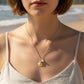 Mellow Monkey gold stainless steel shell charm necklace with pearl accent, adjustable 16+3 inches.