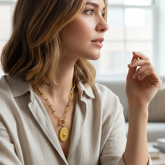 Mellow Monkey 18k gold plated oval starburst necklace with cubic zirconia on an 18-inch chain.