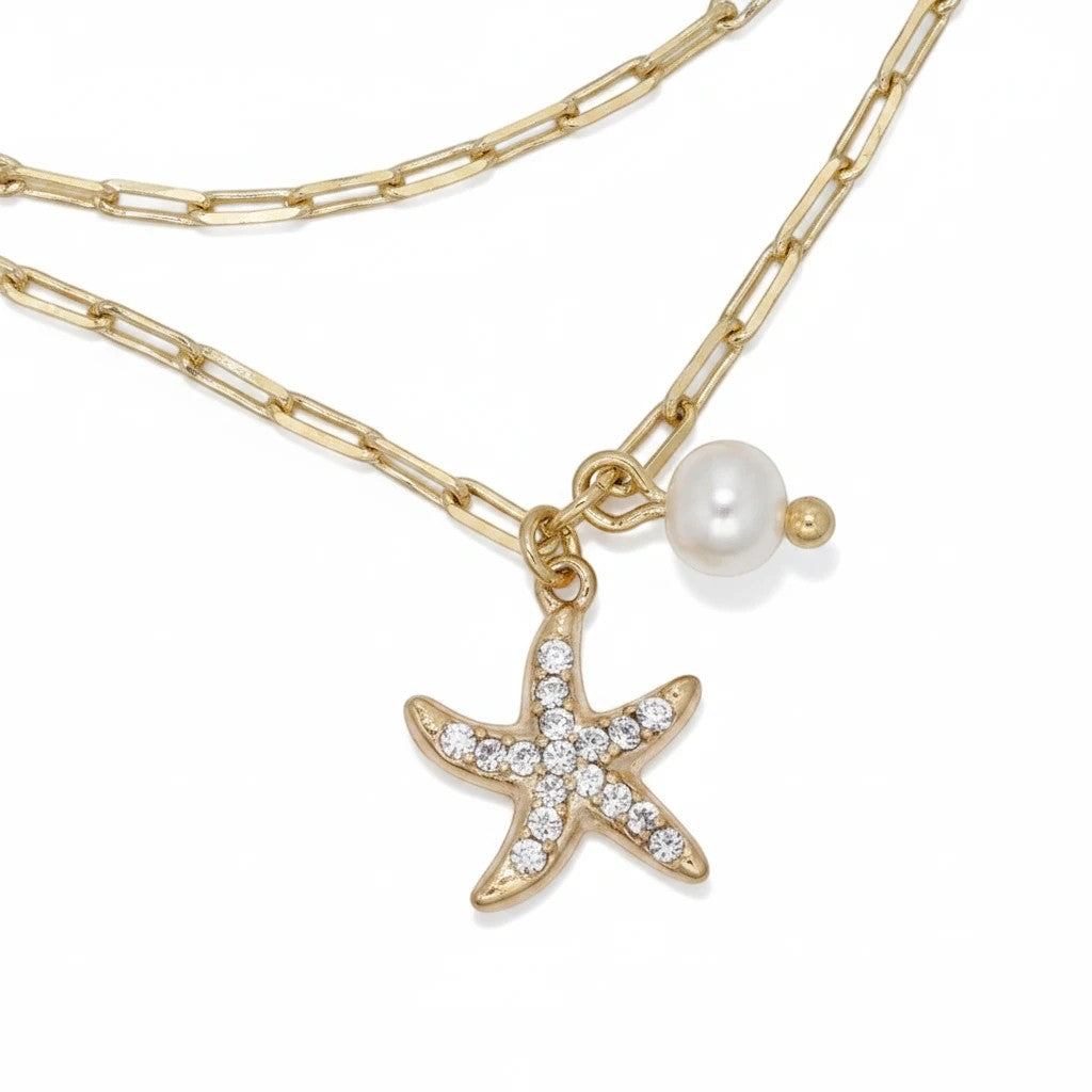 Mellow Monkey gold chain anklet featuring a crystal-encrusted starfish charm and a small white pearl accent