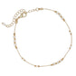 Mellow Monkey gold anklet with delicate white beads, featuring a lobster clasp and adjustable chain.
