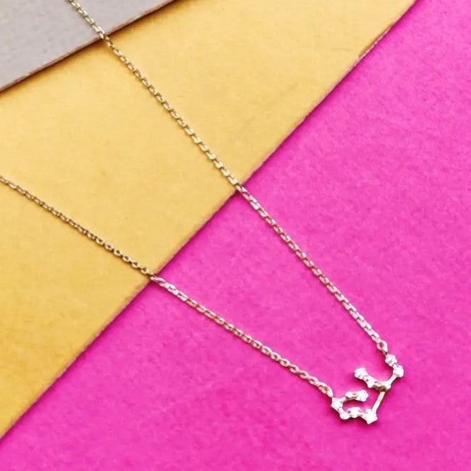 Mellow Monkey gold zodiac constellation necklace with cubic zirconia accents, 16-inch chain with extension.