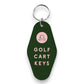 Mellow Monkey dark green motel-style keychain with a pink golf cart icon and Golf Cart Keys text in pink lettering.