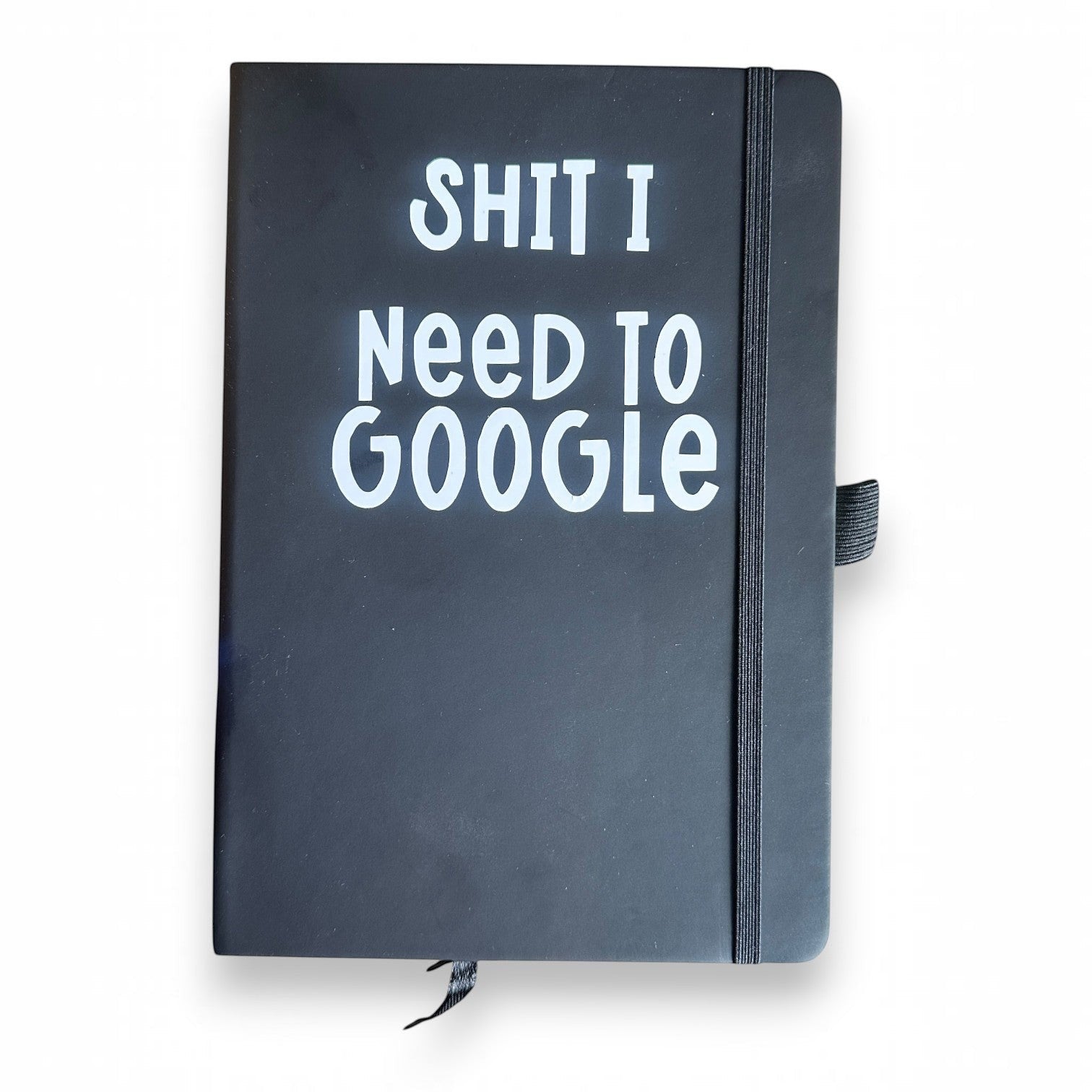 Mellow Monkey black lined journal with "SHIT I Need To Google" in white text. Features an elastic closure and ribbon bookmark.
