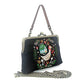 Mellow Monkey black linen kisslock bag featuring embroidered goose and cottage design with detachable straps