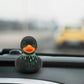 Mellow Monkey gothic rubber duck with neon green blood drips and Cute But Dead Inside text on a car dashboard
