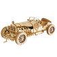 Mellow Monkey 3D laser cut wooden Grand Prix car puzzle with intricate engine detail and spoked wheels.