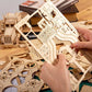 Mellow Monkey Grand Prix Car 3D wooden puzzle kit with laser-cut plywood pieces and gears.