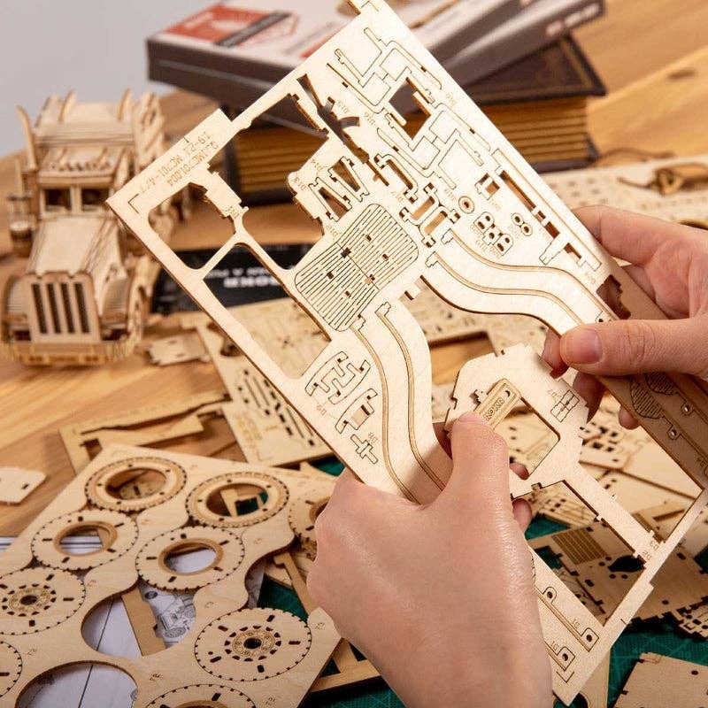 Mellow Monkey Grand Prix Car 3D wooden puzzle kit with laser-cut plywood pieces and gears.