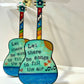 Mellow Monkey hand-painted wooden Grateful Dead guitar ornament with lyrics and ribbon loop on a mini easel