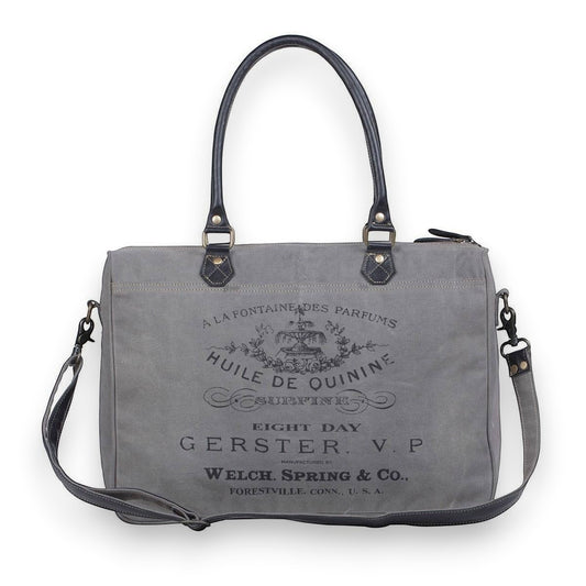 Mellow Monkey Grays Inlaid messenger bag in grey cotton with leather trim and vintage-style black typography print.