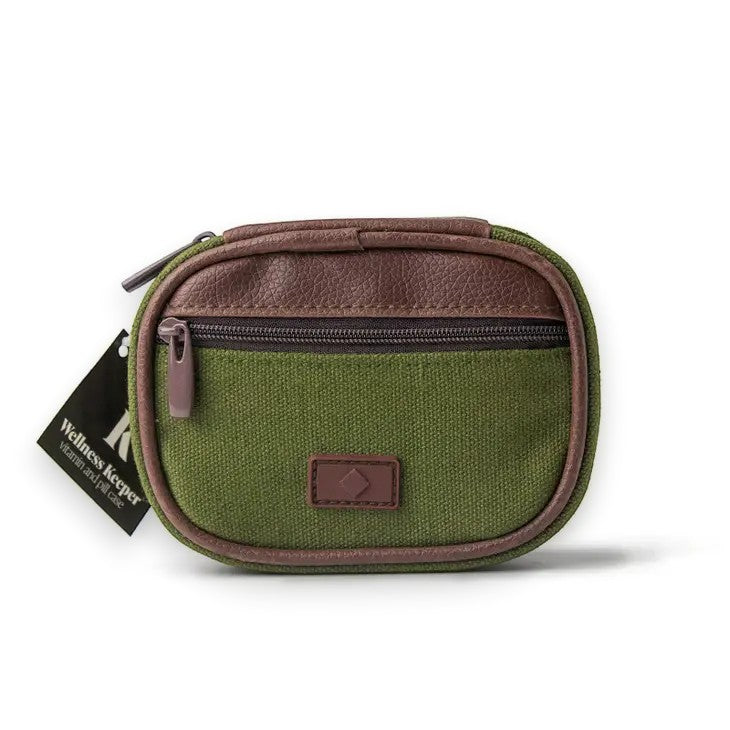 Mellow Monkey green canvas travel pill and vitamin case with brown trim and zippered pocket.