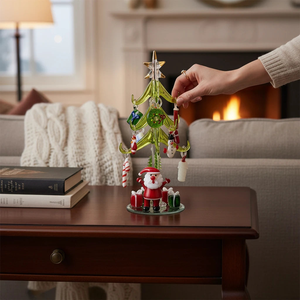 Mellow Monkey 8-inch green glass Christmas tree with hanging holiday icon ornaments and a Santa figure base