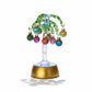Mellow Monkey 9-inch green glass palm tree holiday decoration with colorful mini ornaments and base lighting