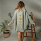 Mellow Monkey green 4-layer muslin kimono robe with gold moon phases design on back, frayed hem.