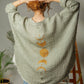 Mellow Monkey green 4-layer muslin kimono robe with golden moon phases design on back. One size.