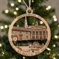 Mellow Monkey round wooden ornament featuring Greenwich CT landmarks and text hanging on a Christmas tree