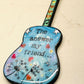 Mellow Monkey hand-painted guitar ornament featuring Bob Dylan lyrics and dandelion art on a blue background.