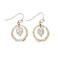 Mellow Monkey hammered gold hoop earrings featuring a central white pearl drop, nickel and lead-free coastal style.