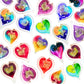 Mellow Monkey collection of colorful hand-blown glass heart ornaments with gold leaf accents on a white background.