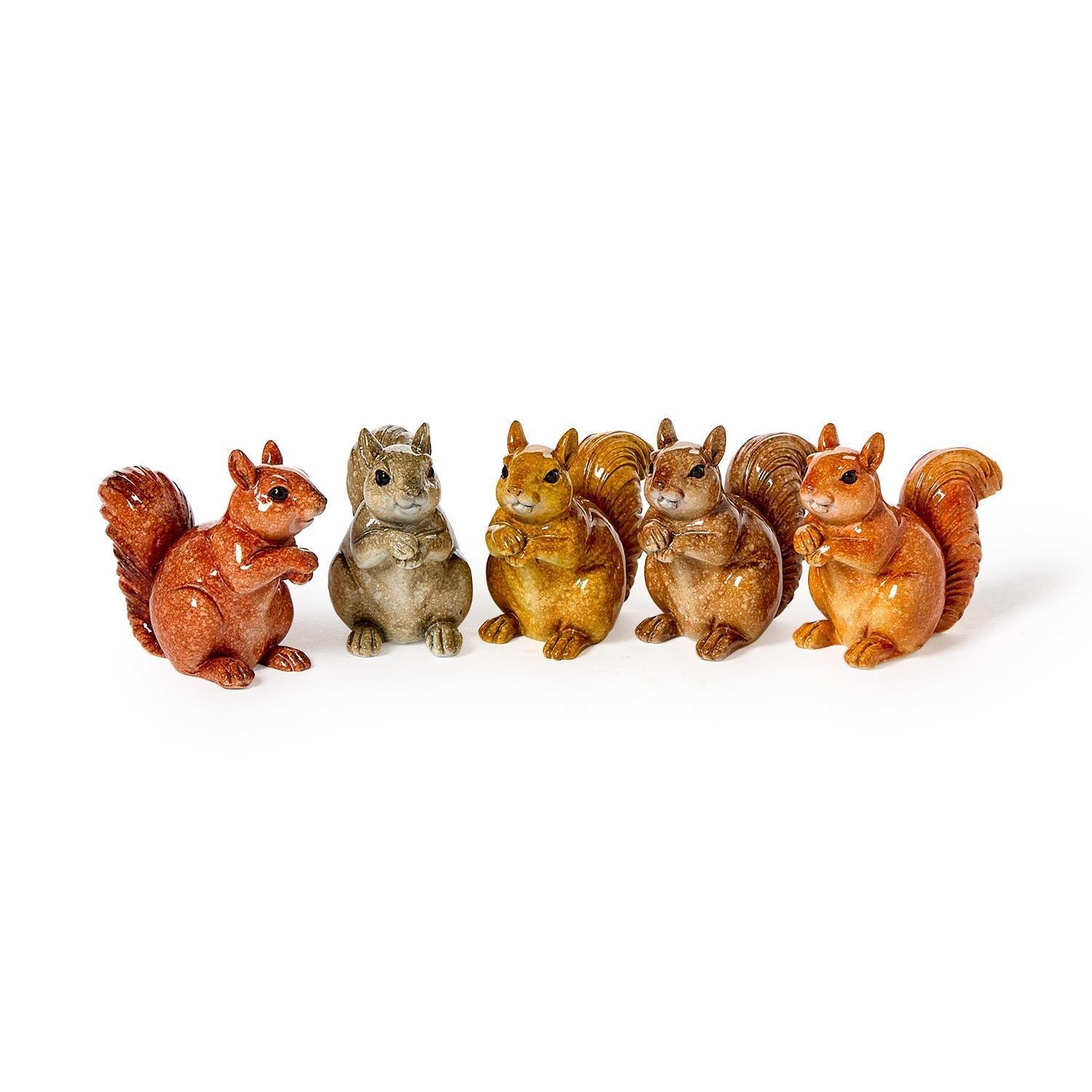 Mellow Monkey hand-painted resin squirrel figurines in various shades of brown and grey standing in a row