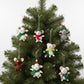Mellow Monkey set of six handmade wool felt mice ornaments in festive holiday outfits hanging on a Christmas tree