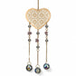 Mellow Monkey heart-shaped suncatcher with gold filigree, healing stones, and dangling crystals for rainbow light.