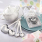 Mellow Monkey heart-shaped stainless steel measuring spoons with engraved sentiments, perfect for baby shower favors.