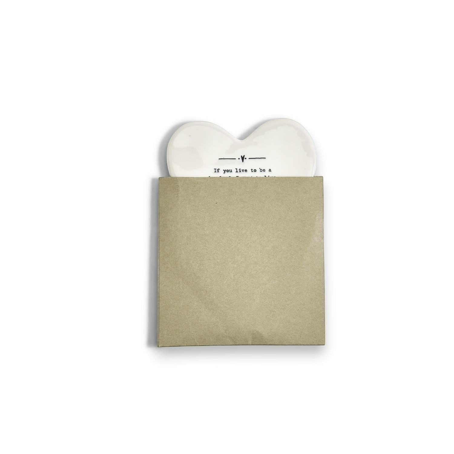Mellow Monkey white porcelain heart-shaped coaster with black text in a protective paper sleeve
