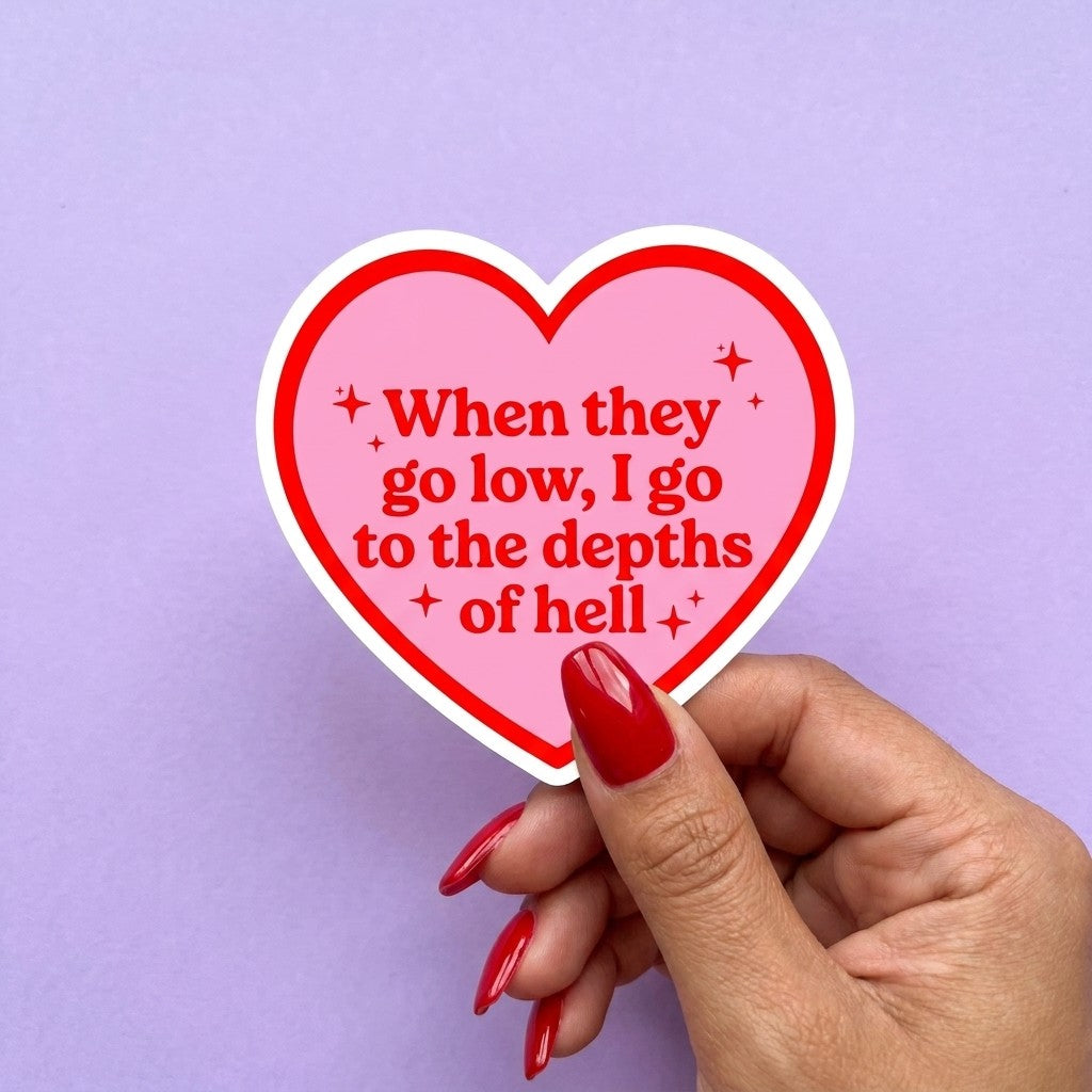 Mellow Monkey heart-shaped sticker with red text reading When they go low I go to the depths of hell on pink