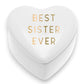 Mellow Monkey white ceramic heart-shaped trinket box with Best Sister Ever in gold lettering.