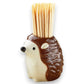 Mellow Monkey brown ceramic hedgehog toothpick holder with bamboo toothpicks on a wooden table with olives