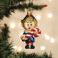 Mellow Monkey Hermey the Elf blown glass Christmas ornament holding a candy cane. Festive holiday decor.