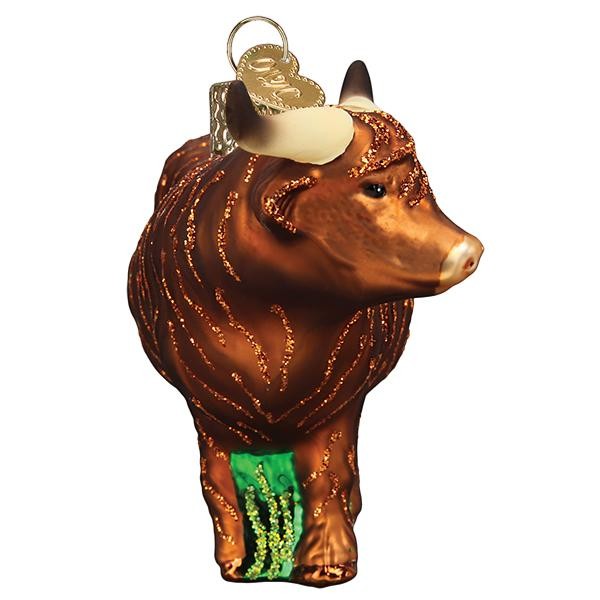 Mellow Monkey Highland Cow blown glass ornament with glitter accents and green grass detail. 4.25-in.
