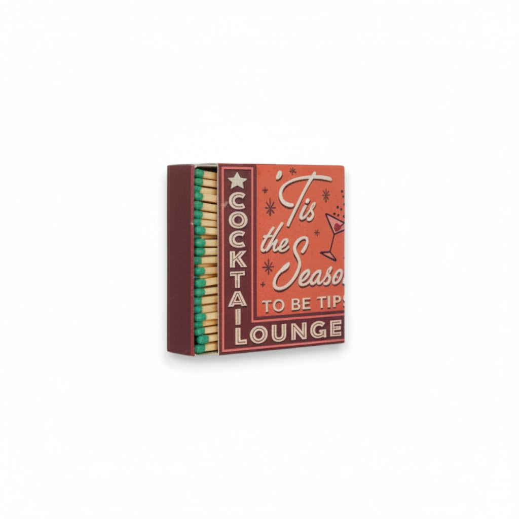 Mellow Monkey holiday matchbox featuring retro Tis the Season to be Tipsy typography and green-tipped safety matches.