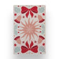 Mellow Monkey recycled microfibre tea towel featuring a festive holiday pattern with red bows, bells, and holly.