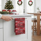 Mellow Monkey recycled microfibre tea towel featuring a red and white Ho Ho Ho holiday pattern hanging on a kitchen